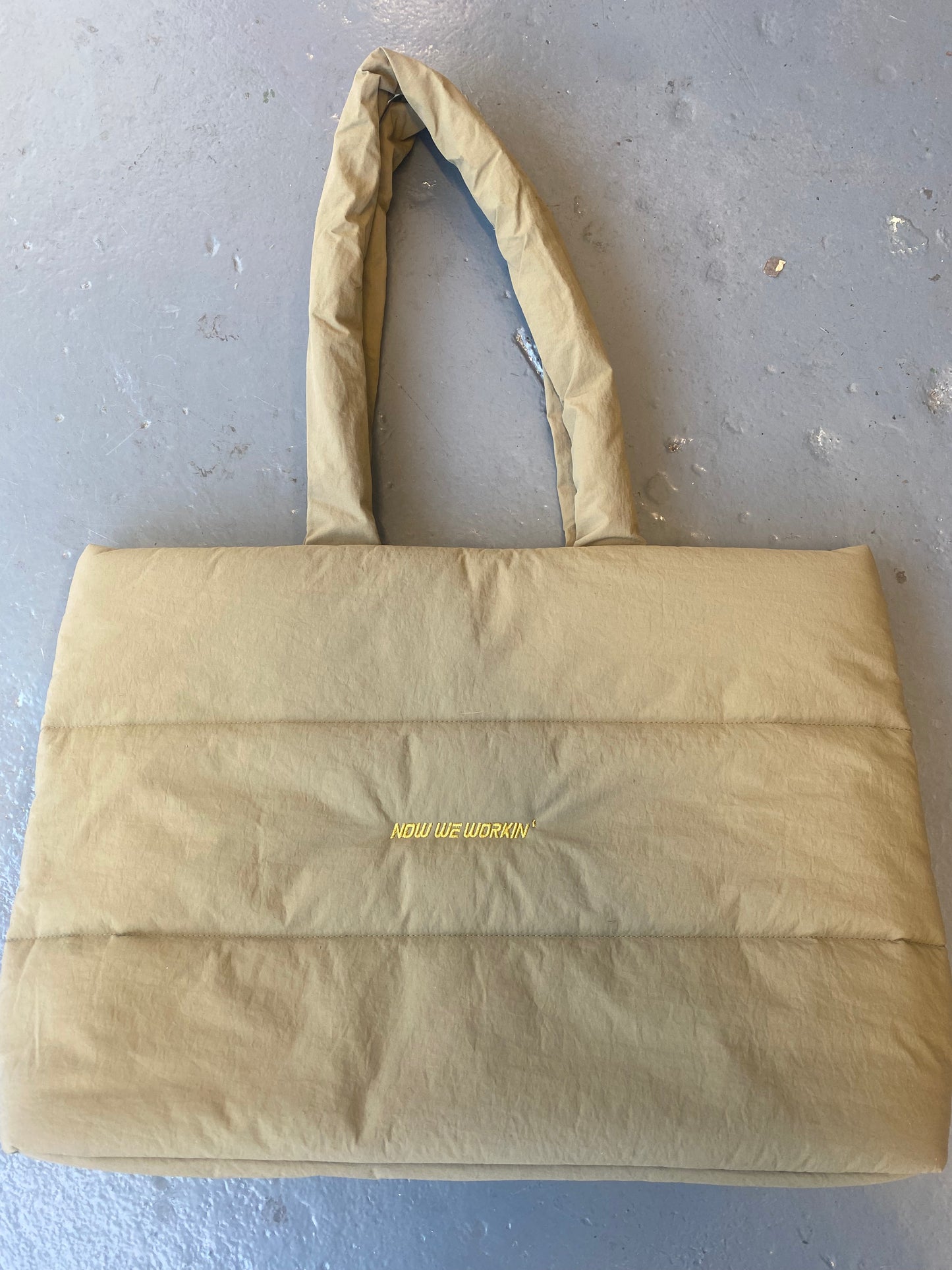 Now We Workin’ Quilted tote bag