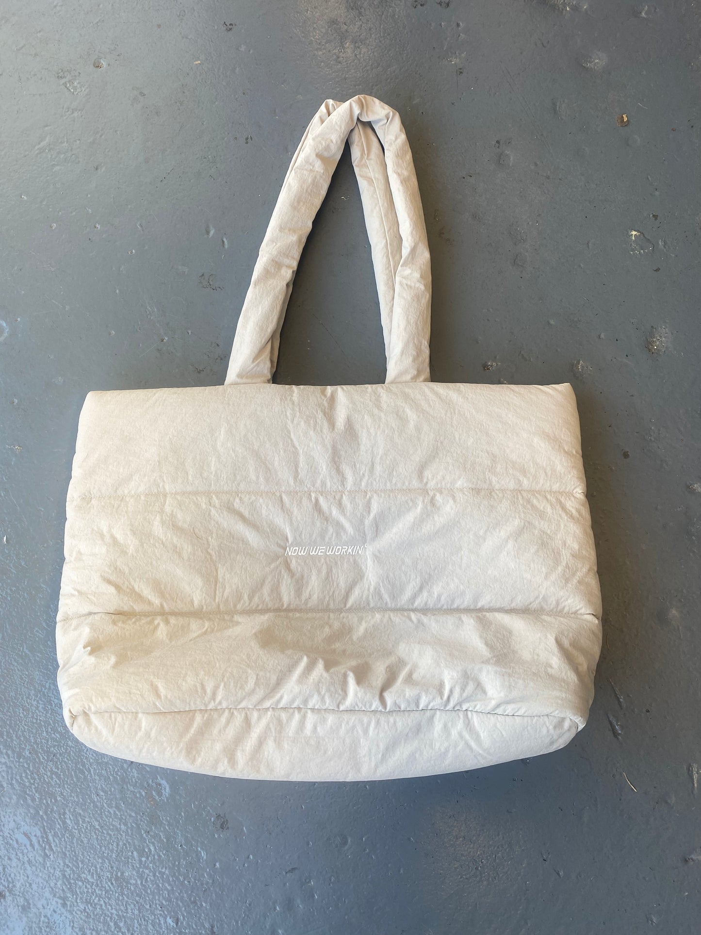 Now We Workin’ Quilted tote bag